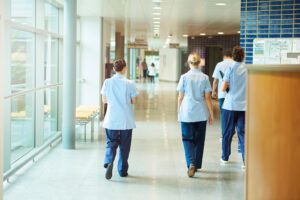 nurses walking in a hospital corridor
