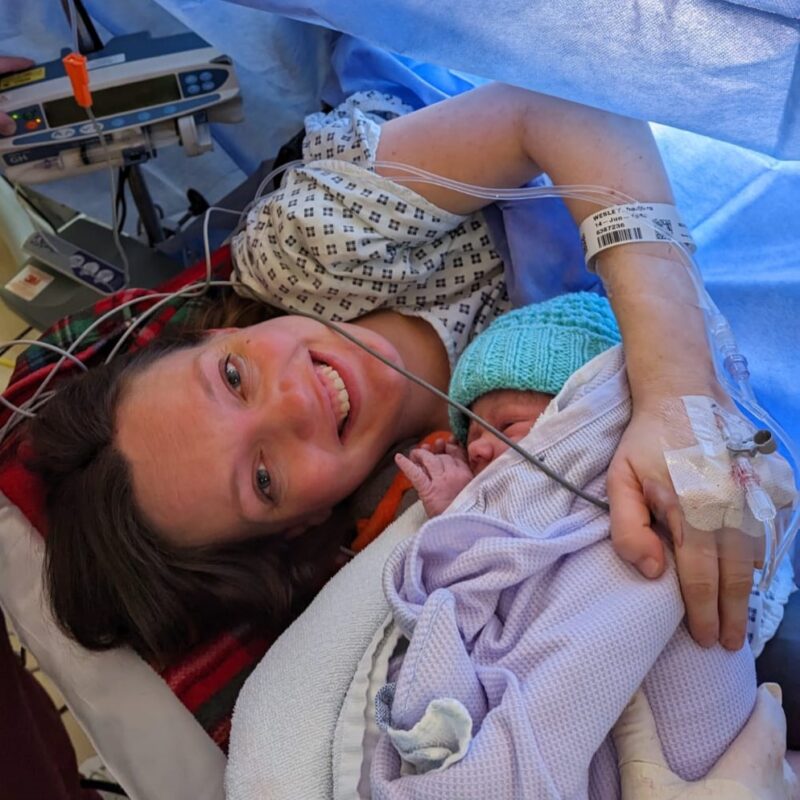 Image of barbara lying down in an operating theatre after giving birth