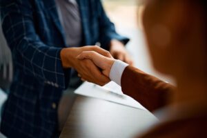 People shaking hands in a job interview
