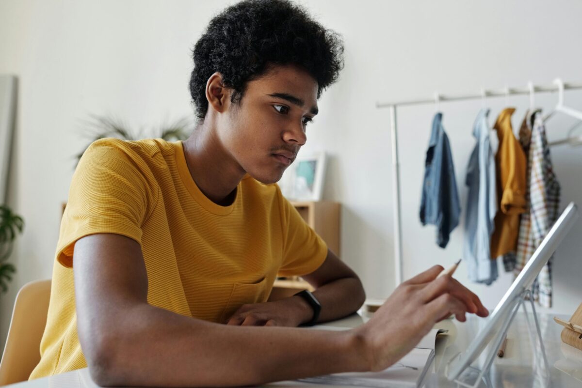 Young adult person using a tablet device.