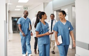 Doctors and nurses walking together and discussing work