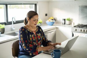 Woman researching menopause information on the computer