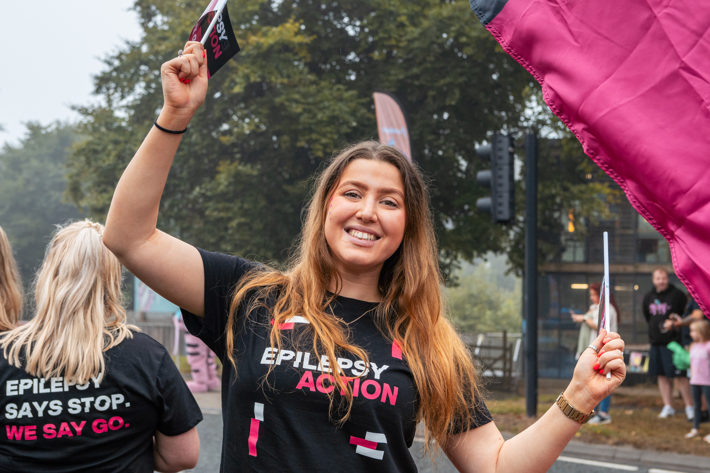 An Epilepsy Action running event volunteer