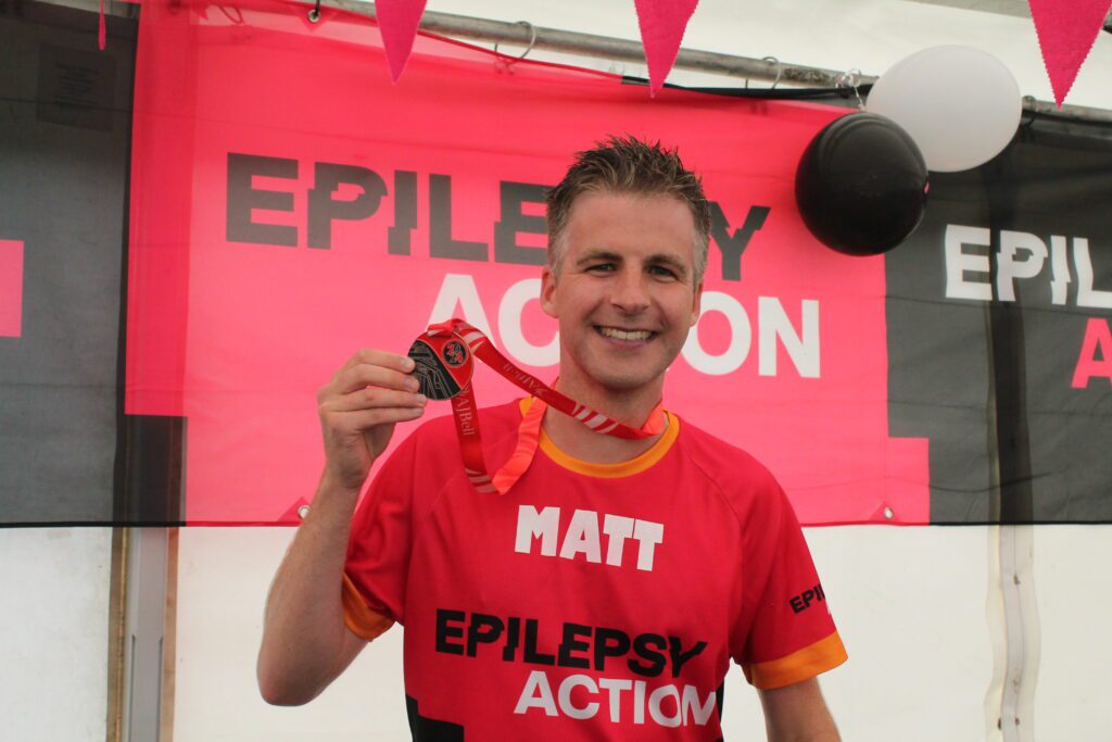 Runner with customised name on his running top.