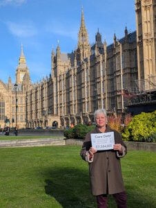 Susan Cole protesting outside Parliament